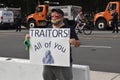 Ã¢â¬ÅTraitors All of You,Ã¢â¬Â Sign Held by a Male Protester Wearing a Wonder Woman Mask at the Justice for J6 Protest